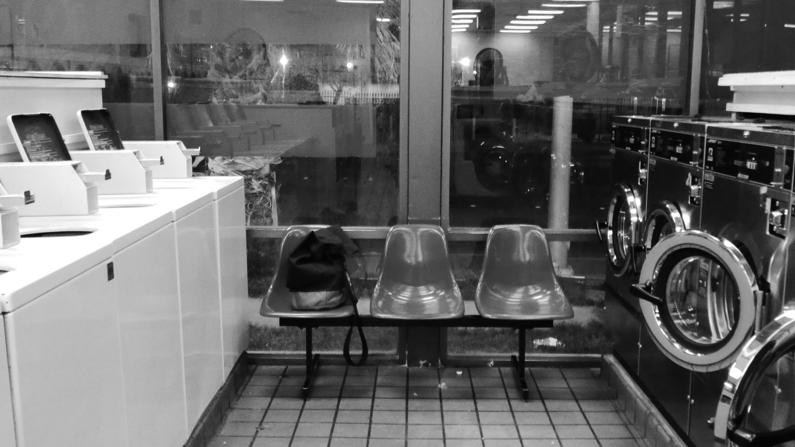 black and white photo of laundromat